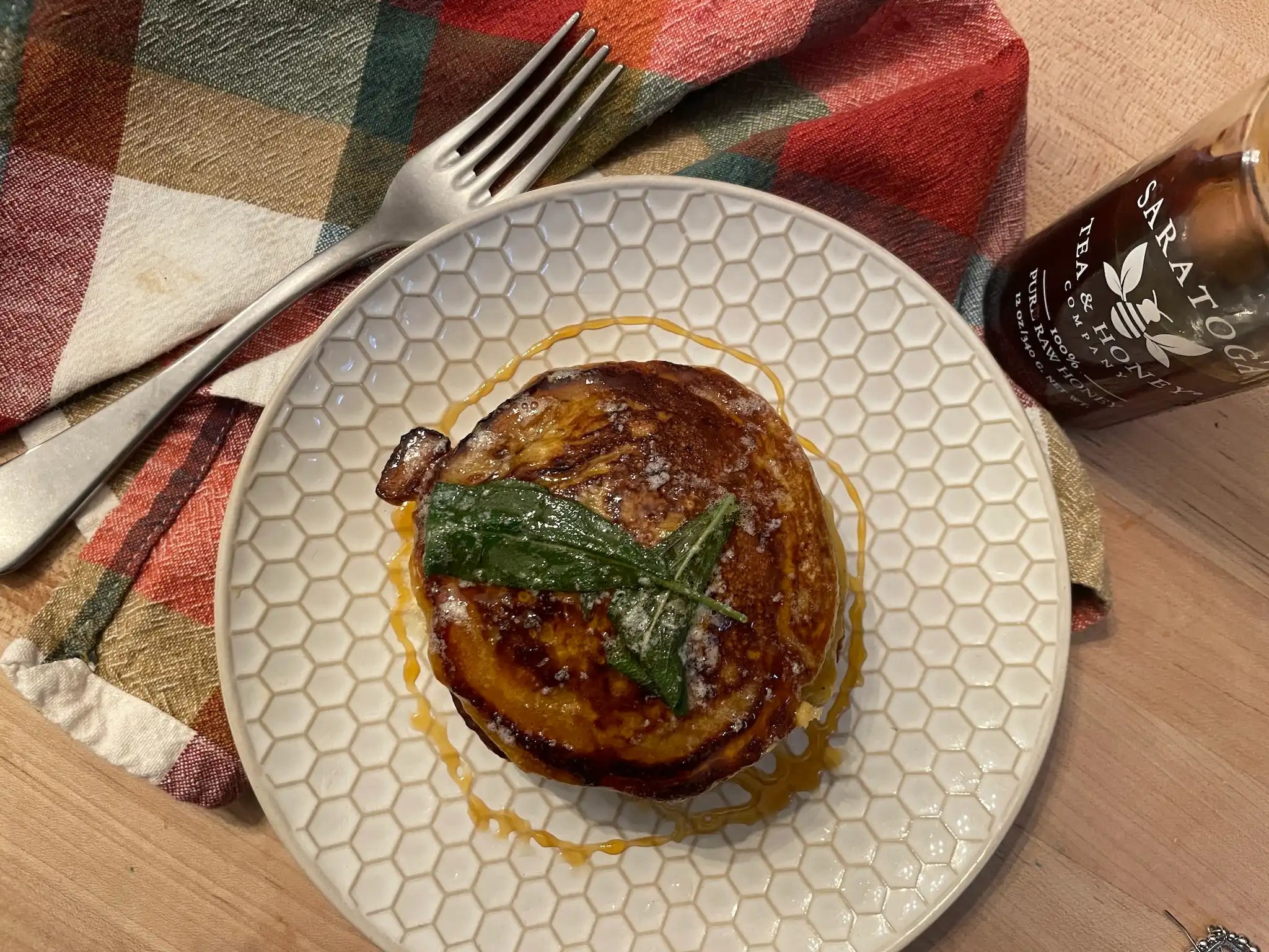 top down view of stack of butternut squash pancakes with honey drizzle