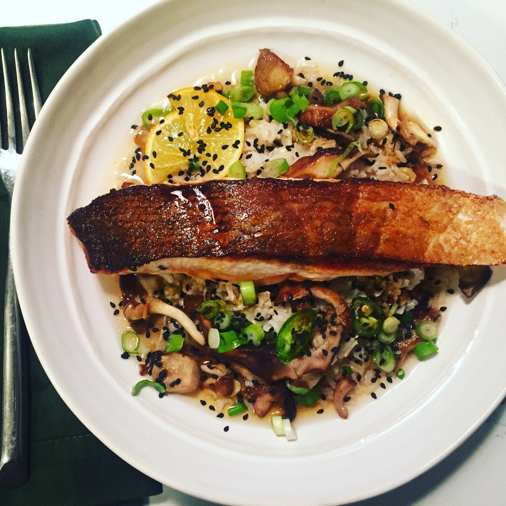 pan seared salmon over rice and veggies with a genmai cha broth