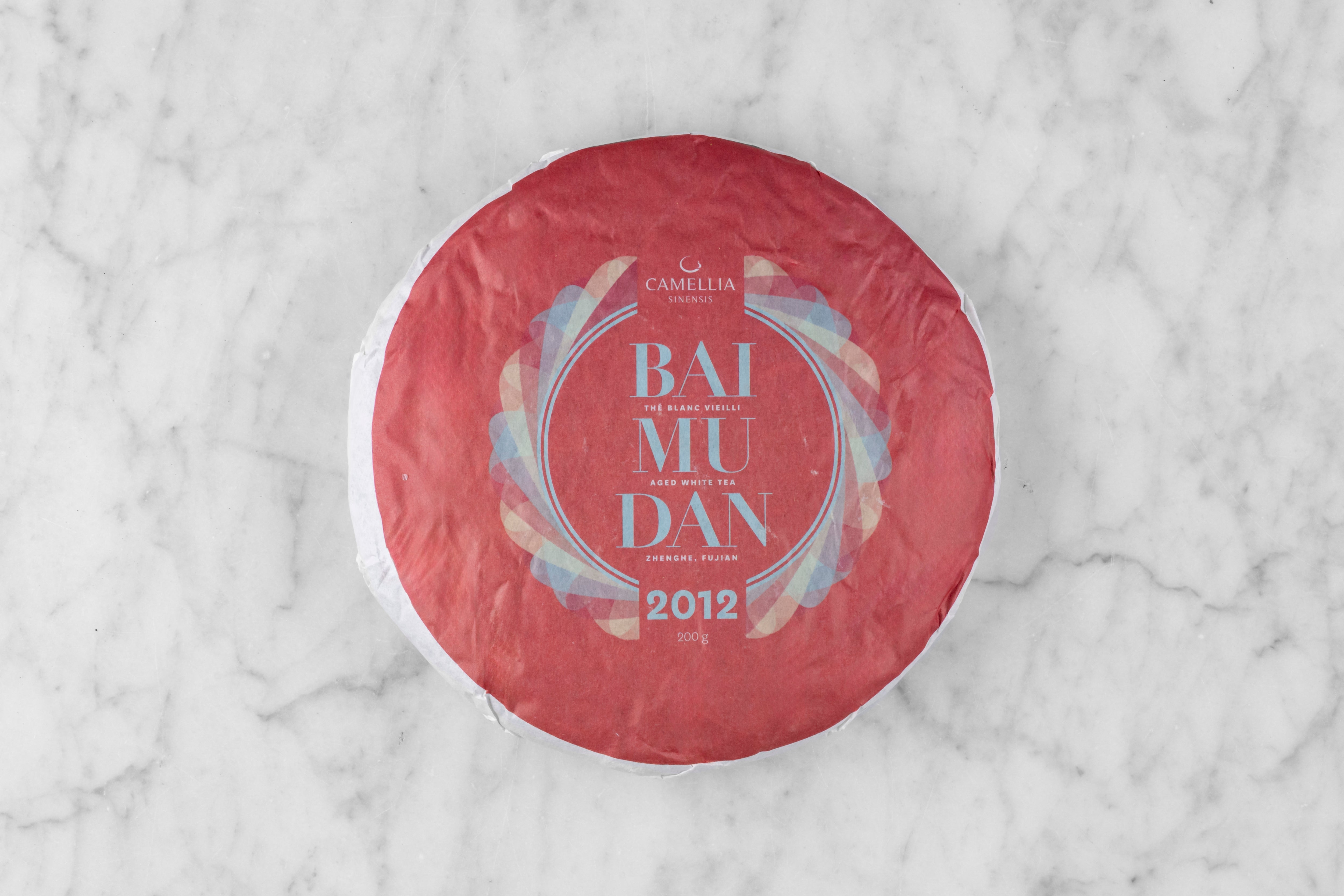 wrapped cake of 2012 Bai Mu Dan sheng pu er aged tea