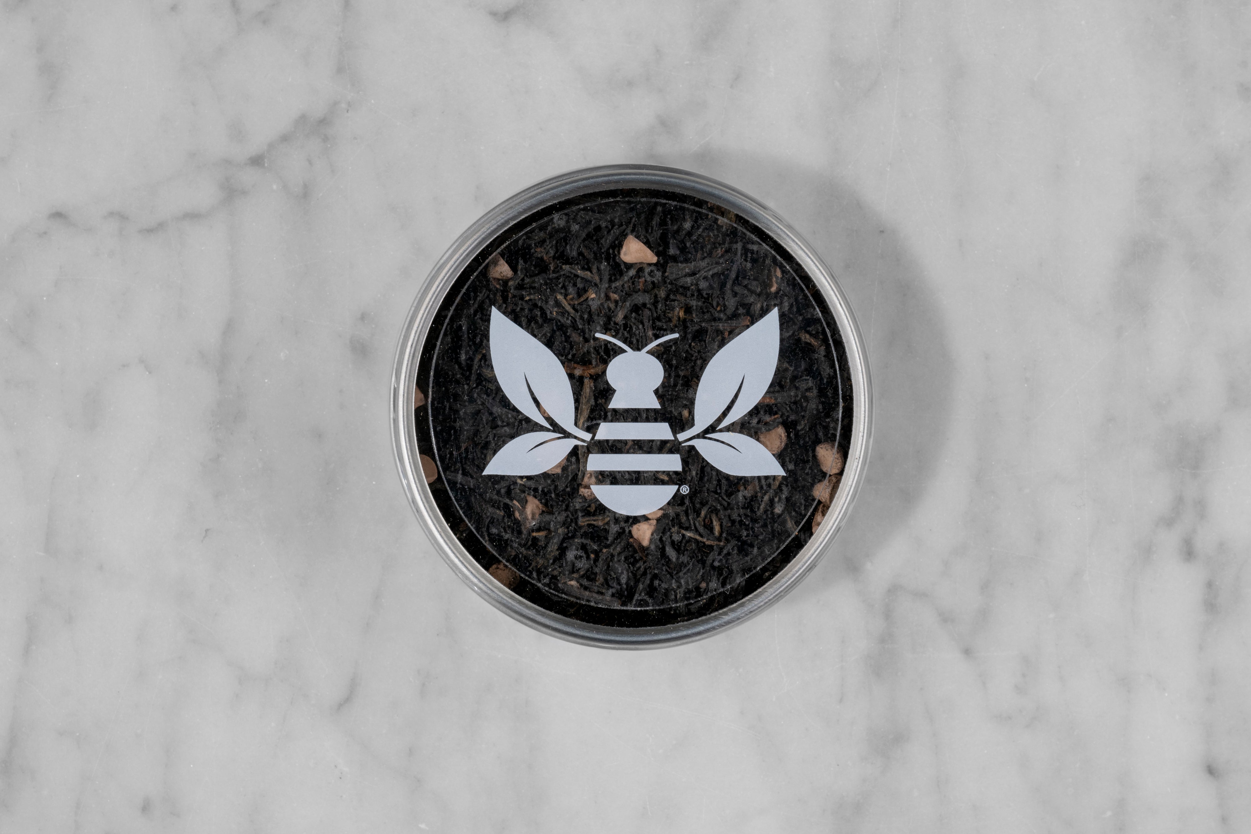 Coco Shou Chocolate Black Tea mini tea tin with a Saratoga Tea & Honey Co. Tea Bee Sticker.