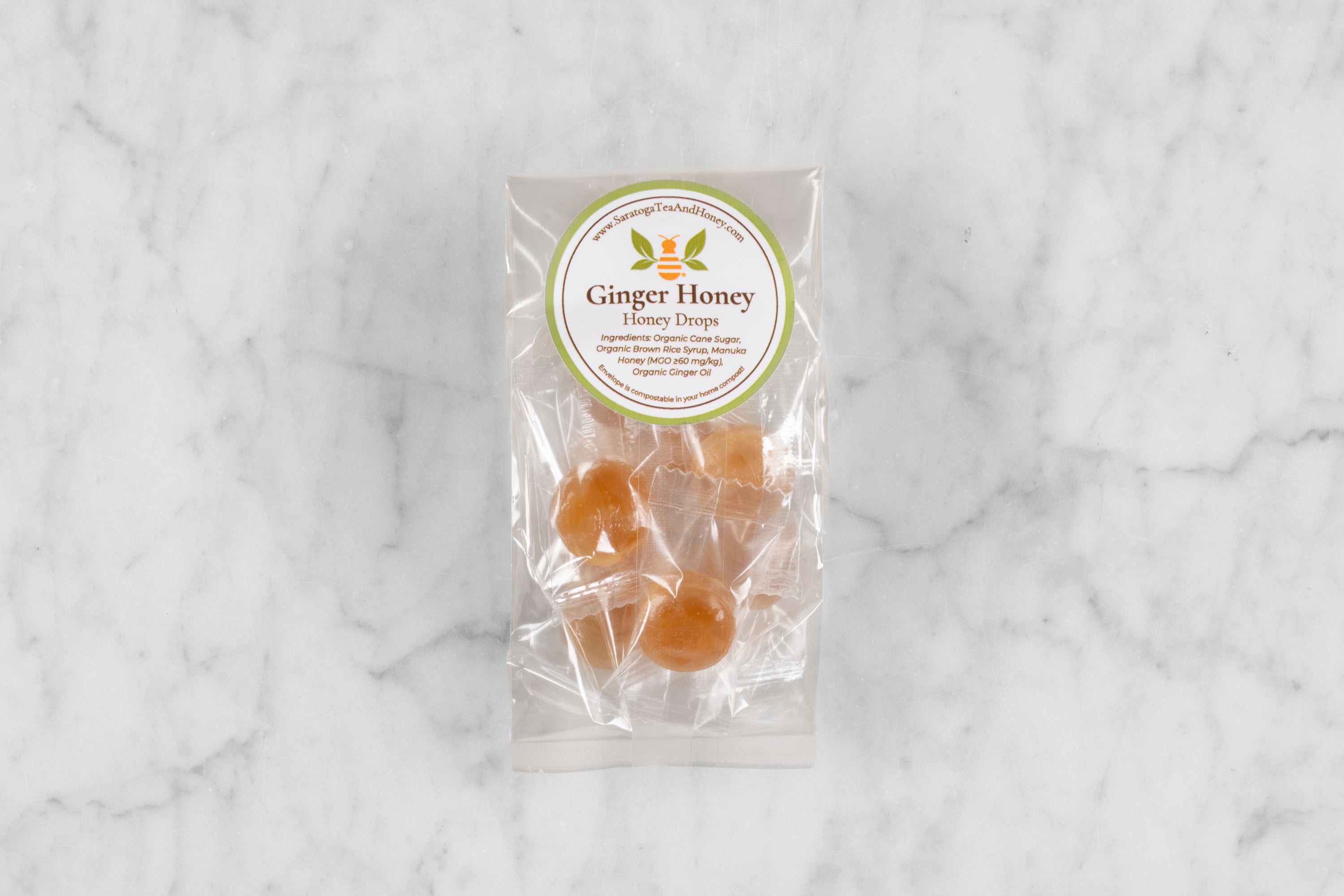 small package of ginger honey candy on marble background