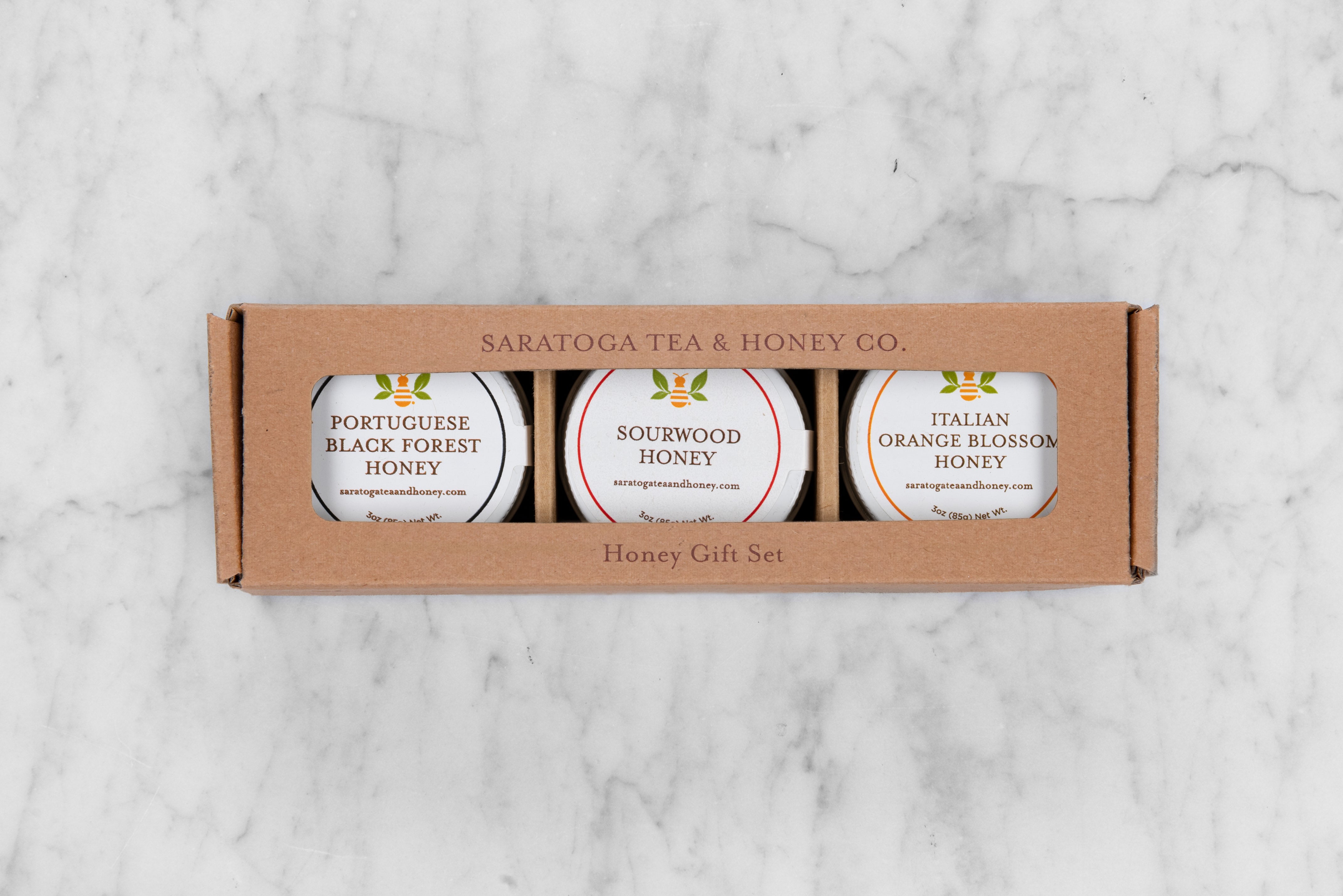 Perfect gift set of mini honeys for charcuterie featuring: Portuguese Black Forest Honey, Sourwood Honey, and Italian Orange Blossom Honey