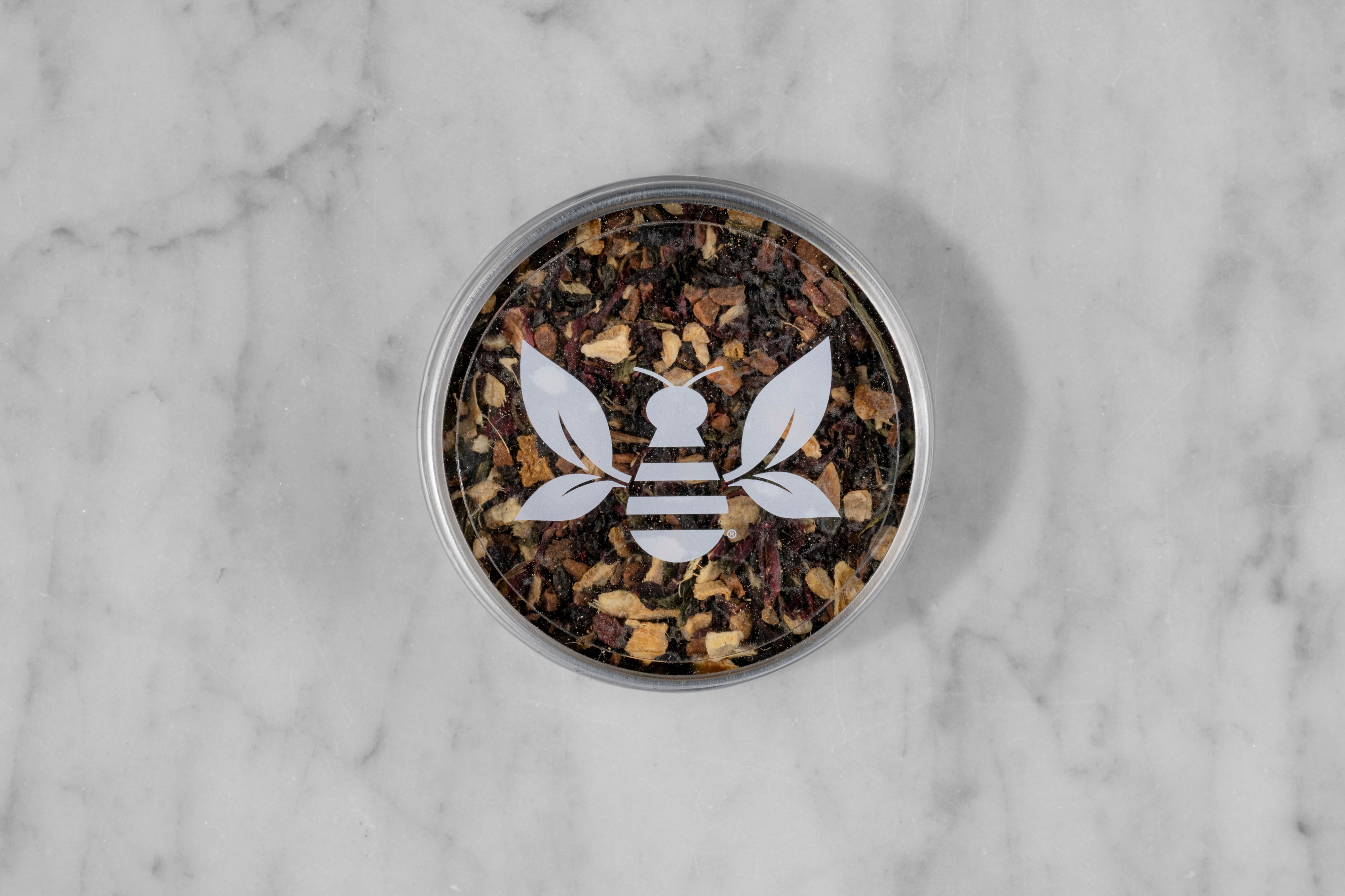 Joyful Joyful holiday tea blend mini tea tin with a Saratoga Tea & Honey Co. Tea Bee Sticker. Allergen warning: may contain peanuts or peanut shell pieces.