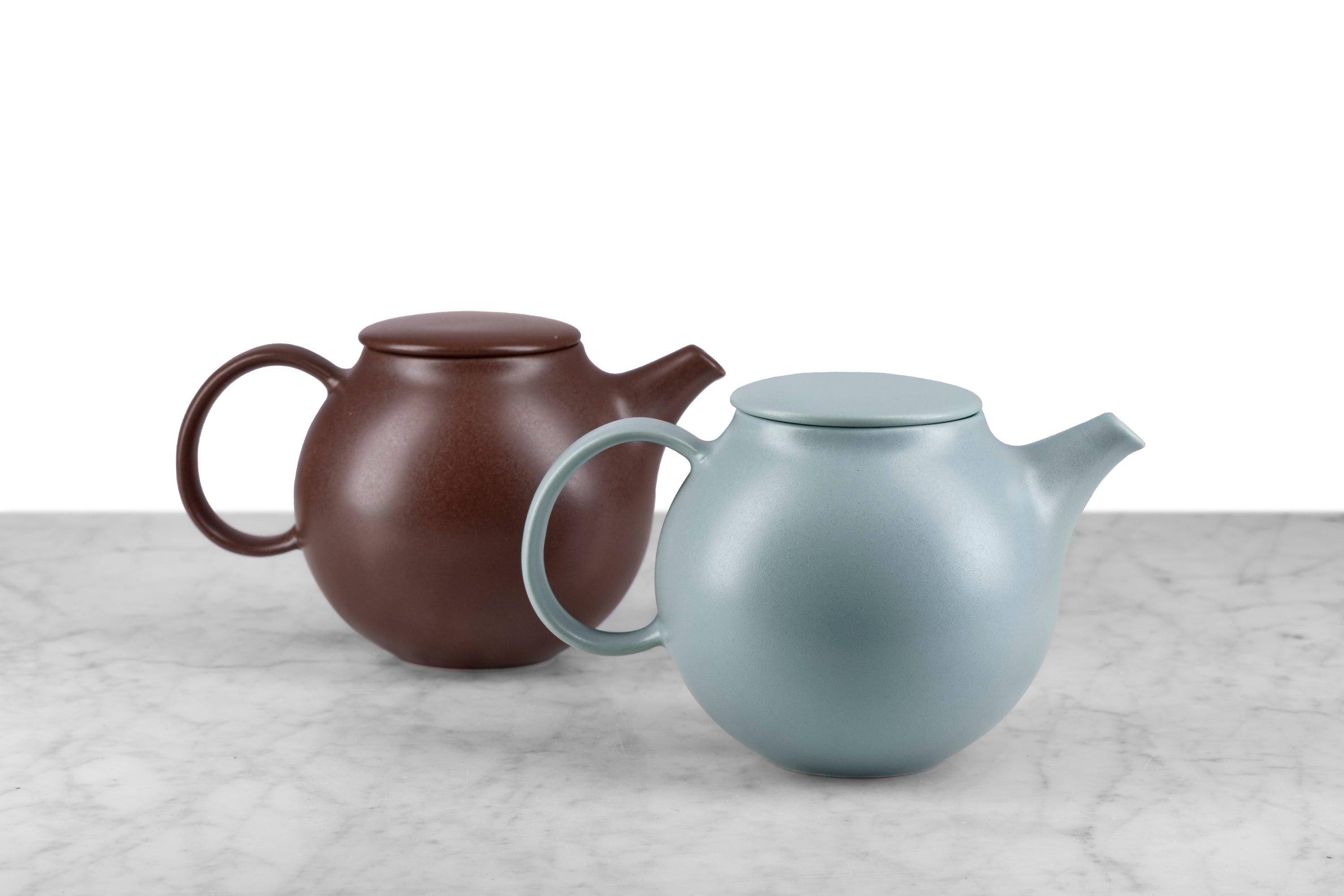 brown and moss green modern teapots by Japanese designer Kinto