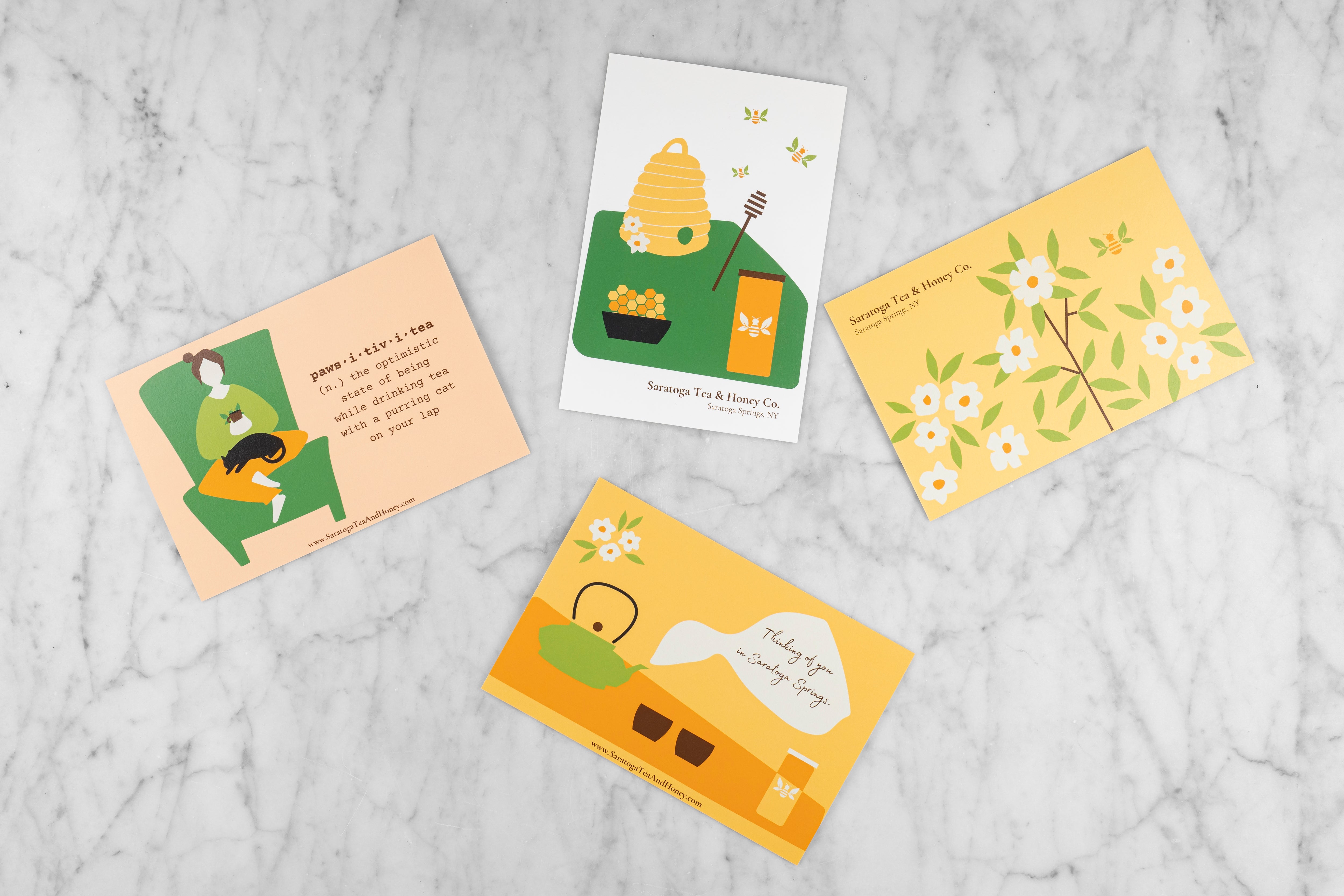 four tea and honey themed postcards 