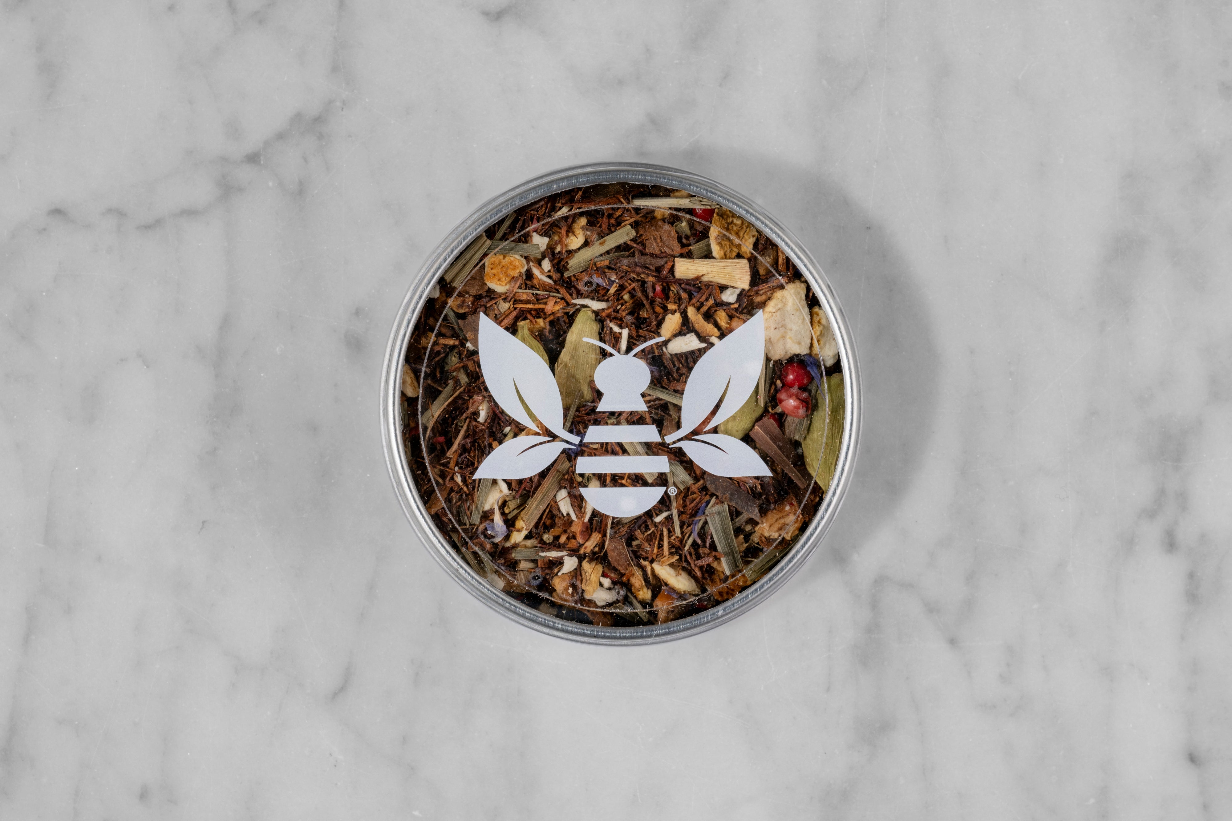 Spirit of Life caffeine-free herbal tisane mini tea tin with a Saratoga Tea & Honey Co. Tea Bee Sticker.