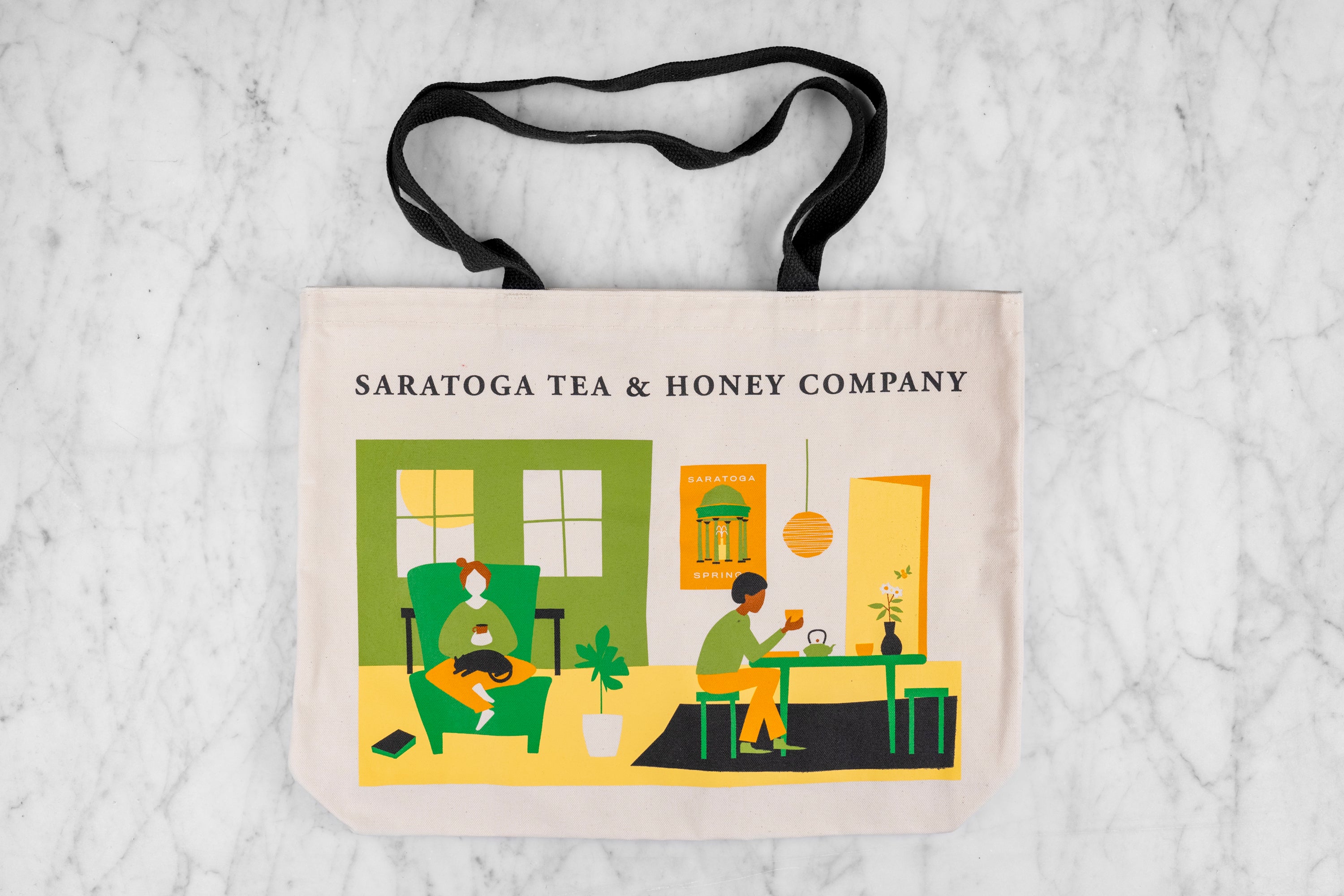 flat lay of saratoga tea and honey co teapartment shoulder tote bag