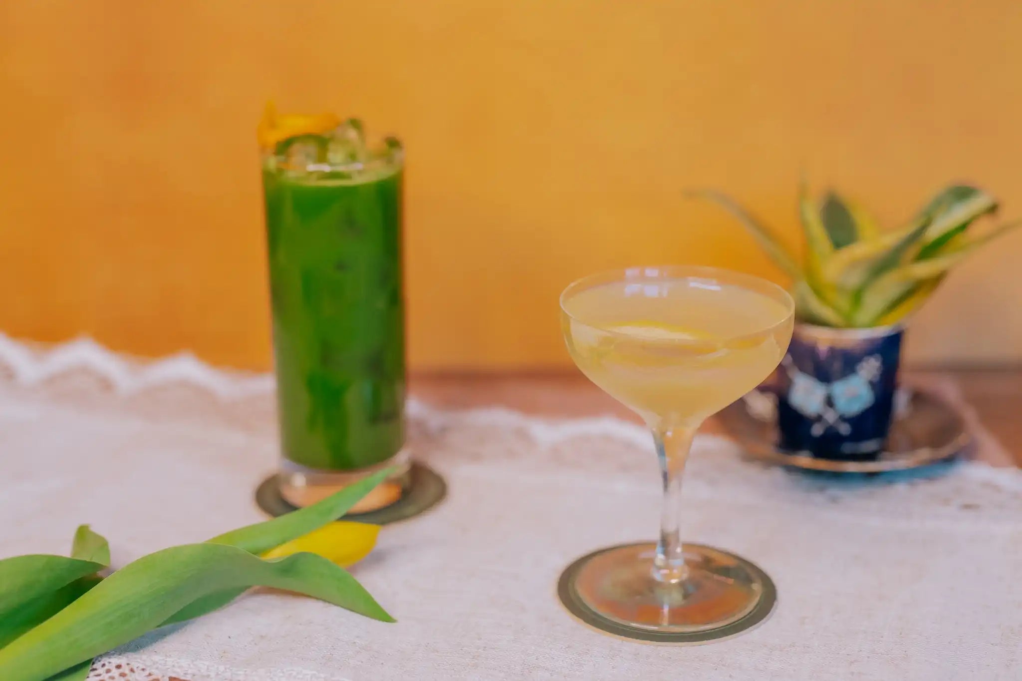 tea and honey cocktails with a yellow background